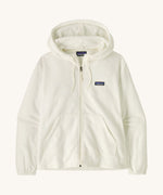 Patagonia women's micro fleece hooded jacket in white on a cream background.