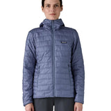 Patagonia Women's Nano Puff Hoody Jacket Current Blue lightweight insulated jacket worn by model front view with hood down