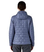 Patagonia Women's Nano Puff Hoody Jacket Current Blue rear view worn by model showing hood and brick quilted insulation