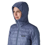 Patagonia Women's Nano Puff Hoody Jacket Current Blue close-up of hood and upper chest showing Patagonia logo and quilted insulation