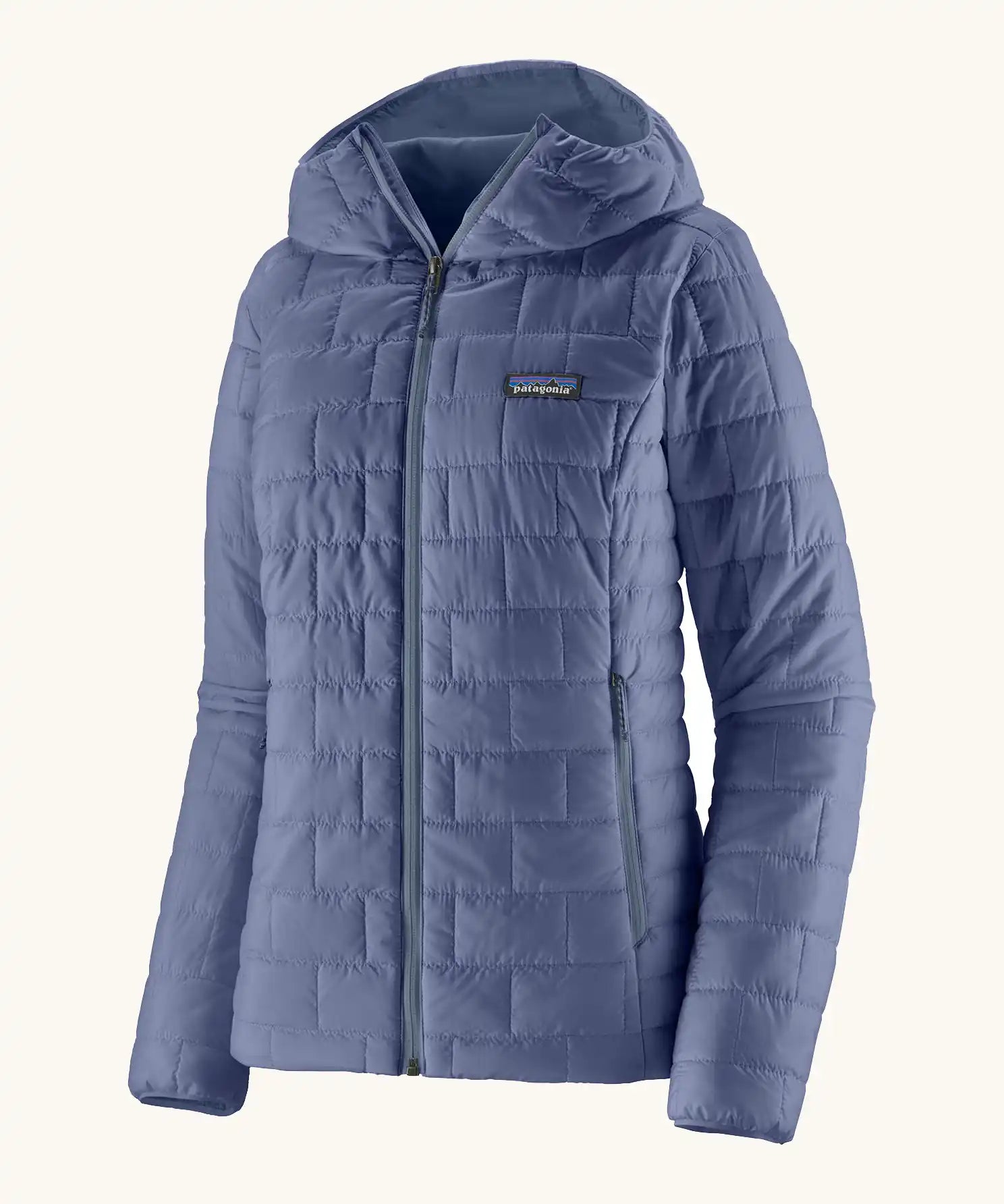 Patagonia Women's Nano Puff Hoody Jacket Current Blue lightweight insulated jacket with hood front angled view showing brick quilting and zip handwarmer pockets