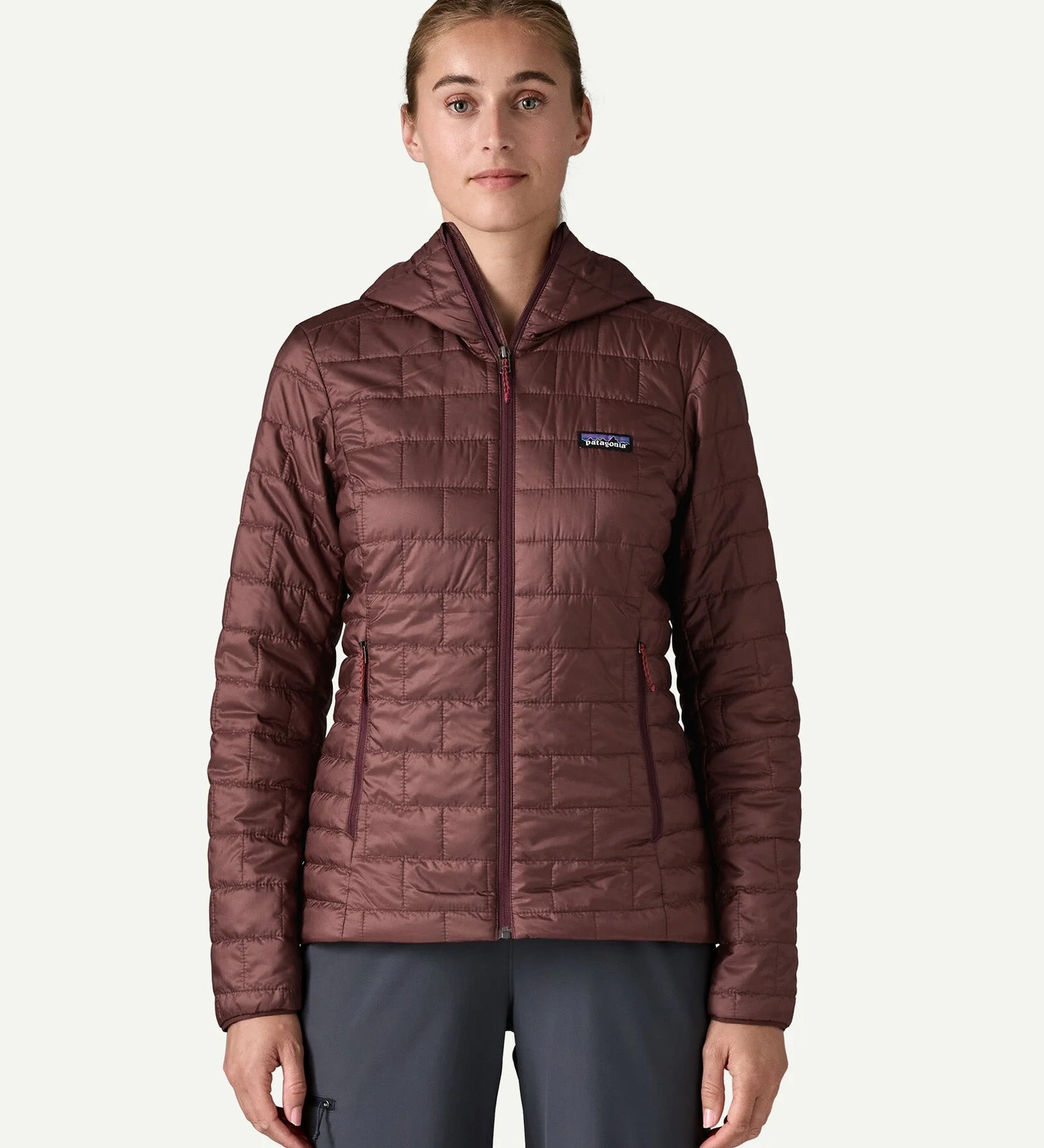 Front close up of the Patagonia Women’s Nano Puff Hoody in Dark Ruby with PrimaLoft Gold Eco insulation and lightweight packable outdoor design.