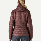 Back view of Patagonia Women’s Nano Puff Hoody Jacket in Dark Ruby showing quilted recycled polyester ripstop design and PFAS free water resistant finish.