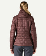 Back view of Patagonia Women’s Nano Puff Hoody Jacket in Dark Ruby showing quilted recycled polyester ripstop design and PFAS free water resistant finish.