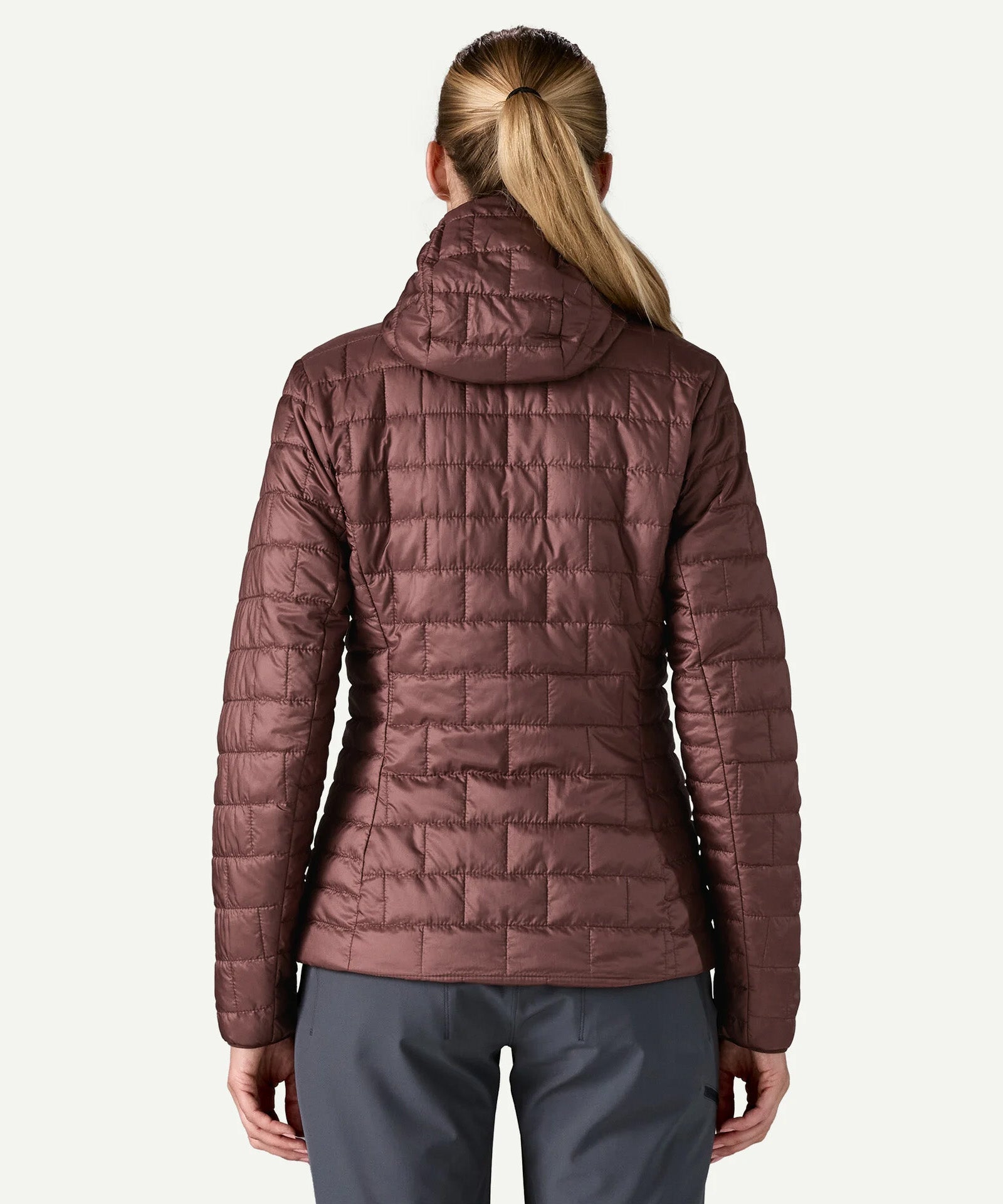 Back view of Patagonia Women’s Nano Puff Hoody Jacket in Dark Ruby showing quilted recycled polyester ripstop design and PFAS free water resistant finish.