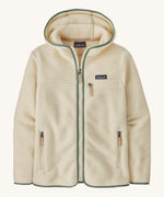 Patagonia Retro Pile Hoody. A women's fleece style jacket in a light cream colour with green trim. Features a full length zip, 2 side pockets, a chest pocket and a logo patch stitched on the left chest.