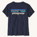 Patagonia women's short sleeve top in navy back logo detail on a cream background.