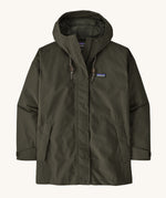 A Patagonia Women's Outdoor Everyday Rain Jacket in a Pine Needle Green colour on a plain background.