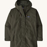A Patagonia Women's Outdoor Everyday Rain Jacket in a Pine Needle Green colour on a plain background.