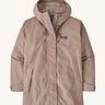 A Patagonia Women's Outdoor Everyday Rain Jacket in a Stingray Mauve colour on a plain background.
