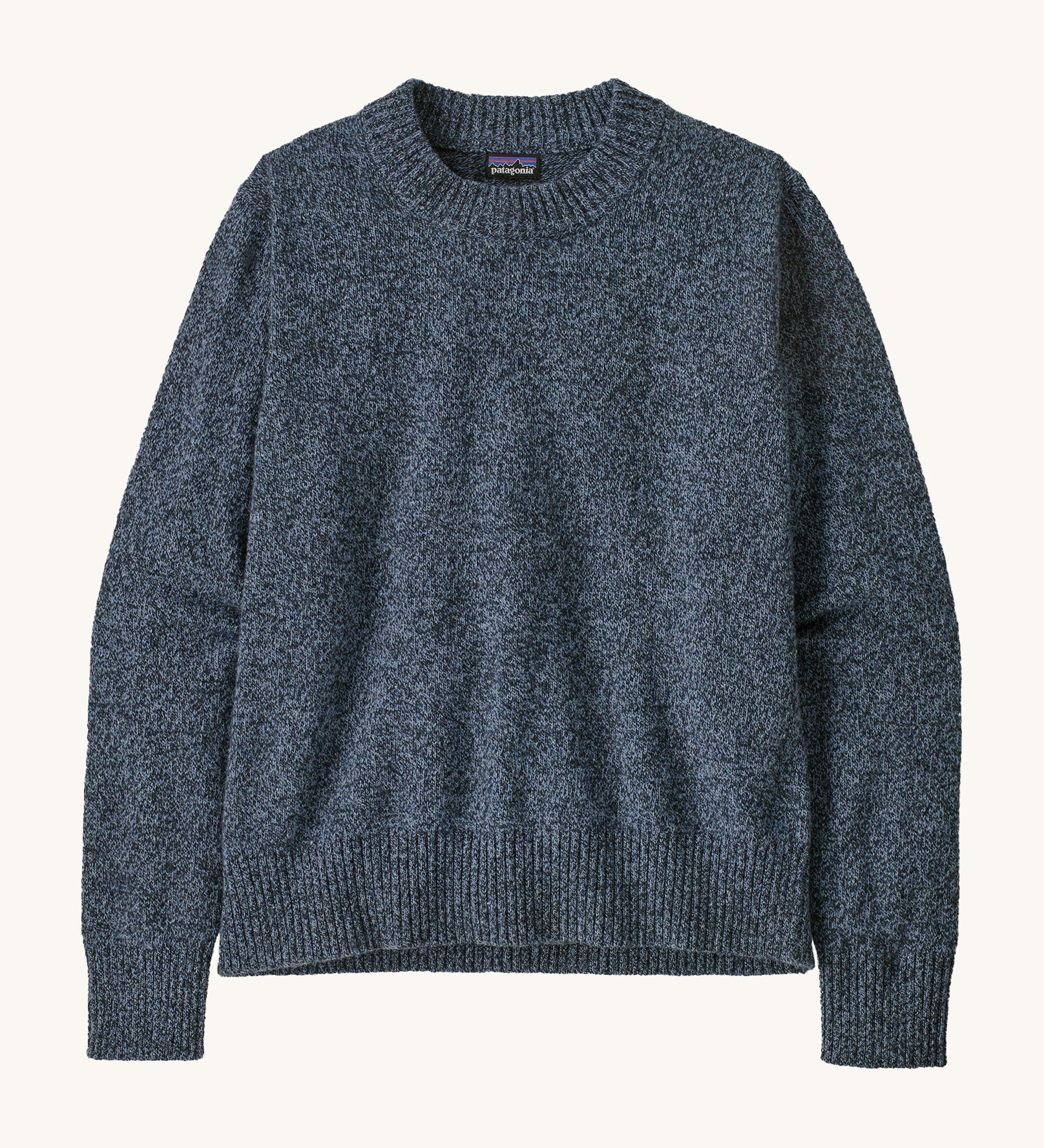 Patagonia Women's Recycled Wool-Blend Crewneck Sweater. A thick knit jumper in dark blue with dappled design