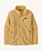 patagonia womens retro pile fleece jacket in a light brown colour on a cream background.
