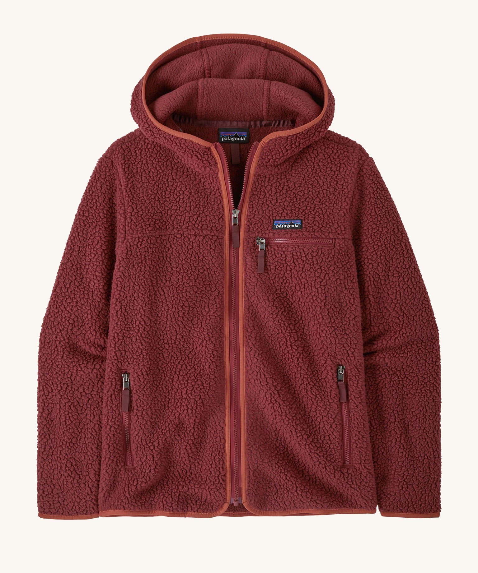 A Patagonia Women's Retro Pile Fleece Hoody Jacket in the Sequoia Red colour way. The dark burgundy red, zipped, hooded ladies fleece has handy zipped pockets.