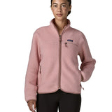 Woman wearing the Patagonia women's retro pile fleece jacket in fuzzy mauve pink. Full zip fleece jacket with zippererd chest and hand warmer pockets.