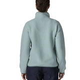 Back of woman wearing the Patagonia women's retro pile fleece jacket in virtually blue. Full zip fleece jacket with zippererd chest and hand warmer pockets.
