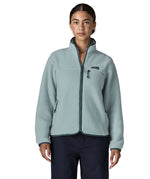 Woman wearing the Patagonia women's retro pile fleece jacket in virtually blue. Full zip fleece jacket with zippererd chest and hand warmer pockets.