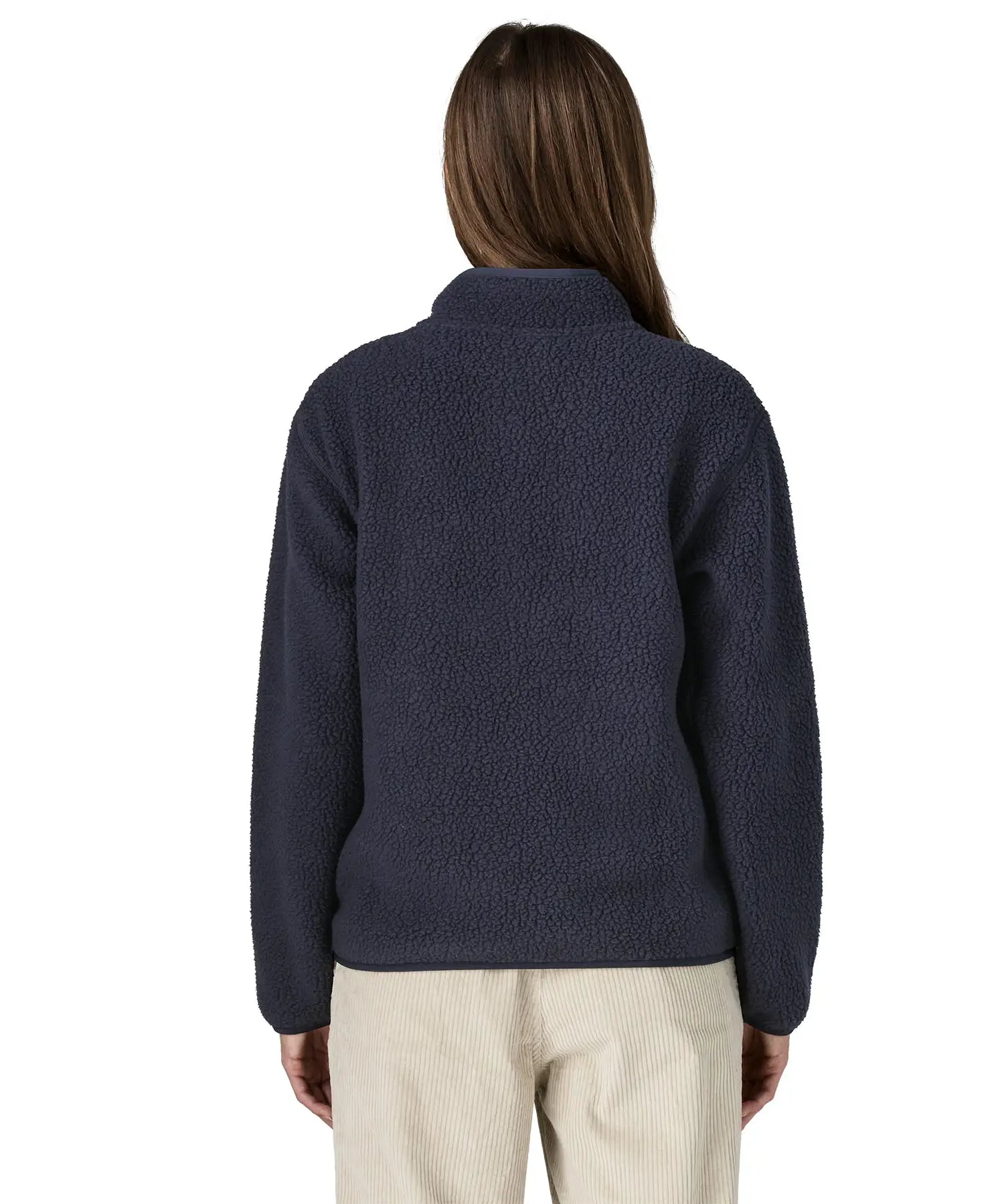 Back of a woman wearing the Patagonia women's retro pile fleece marsupial top in dark sunken blue.