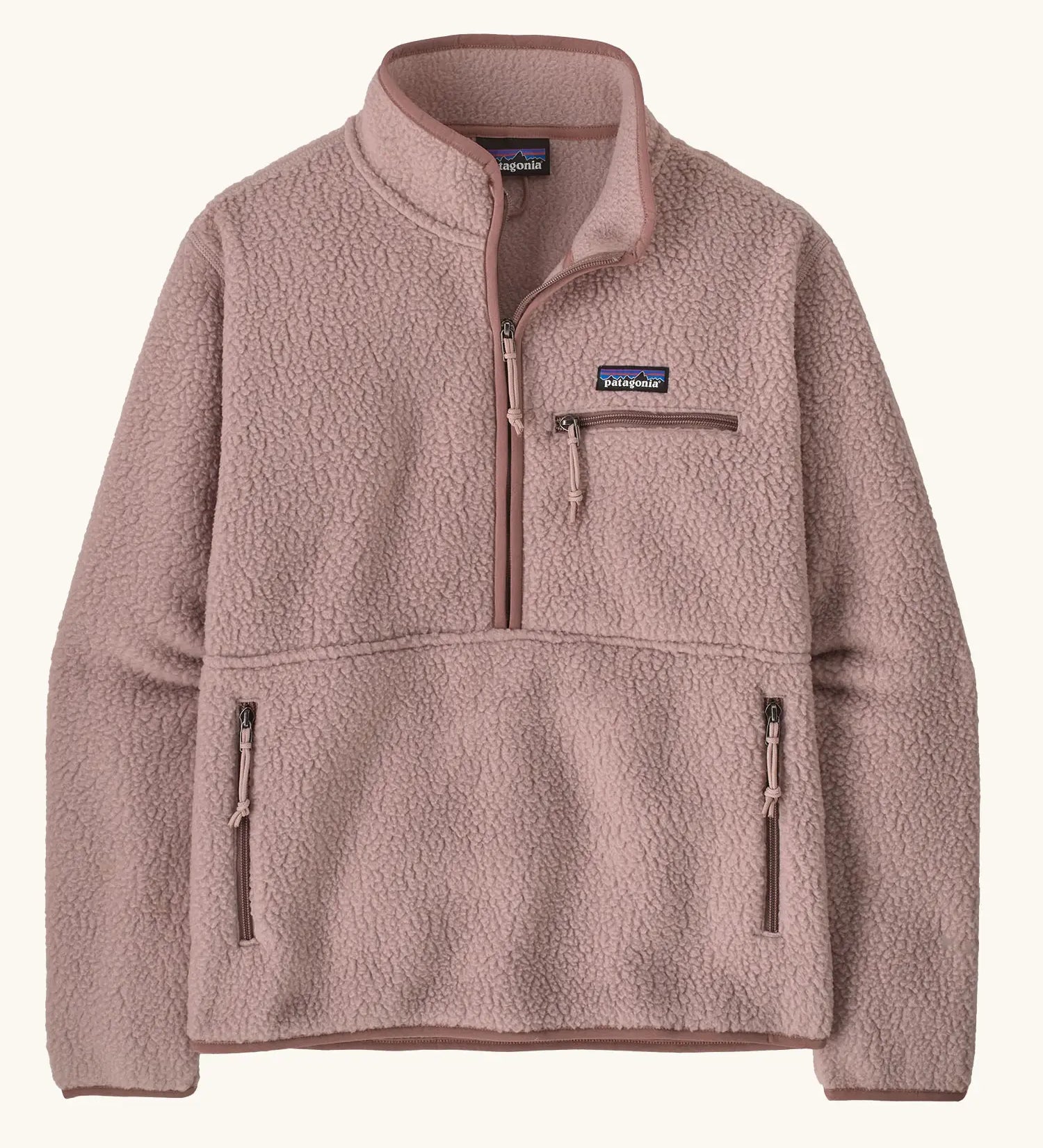 Patagonia women's retro pile fleece marsupial top in stingray mauve. Half zip closure, zippered chest pocket and zippered marsupial hand warmer pocket. 