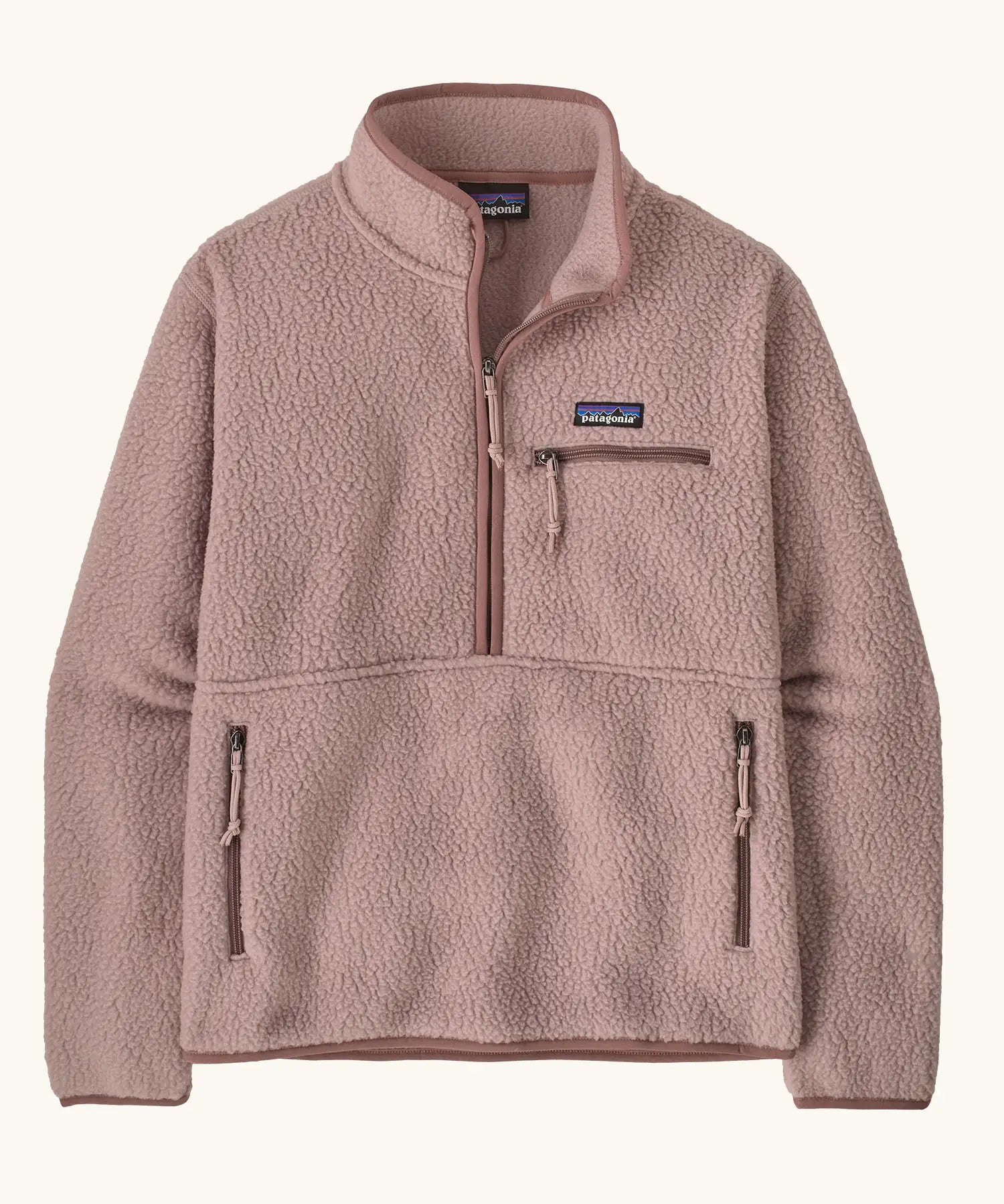 Patagonia women's retro pile fleece marsupial top in stingray mauve. Half zip closure, zippered chest pocket and zippered marsupial hand warmer pocket. 