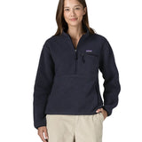 Woman wearing the Patagonia women's retro pile fleece marsupial top in dark sunken blue.