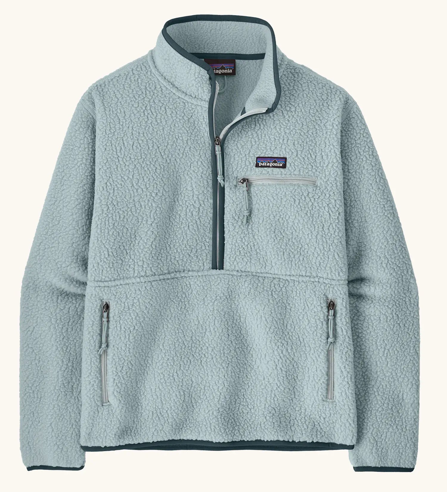 Patagonia women's retro pile fleece marsupial top in light virtually blue. Half zip closure, zippered chest pocket and zippered marsupial hand warmer pocket. 