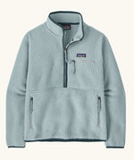 Patagonia women's retro pile fleece marsupial top in light virtually blue. Half zip closure, zippered chest pocket and zippered marsupial hand warmer pocket. 