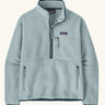Patagonia women's retro pile fleece marsupial top in light virtually blue. Half zip closure, zippered chest pocket and zippered marsupial hand warmer pocket. 