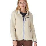 A woman wearing the Patagonia women's retro pile fleece i natural colour available at Babipur. A thick light purple fleece with a contrast blue trim. Features a full length zip, 2 side pockets and a chest pocket with the brand patch stitched above.