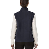 Back of woman wearing the Patagonia women's retro pile fleece vest gilet in sunken blue.