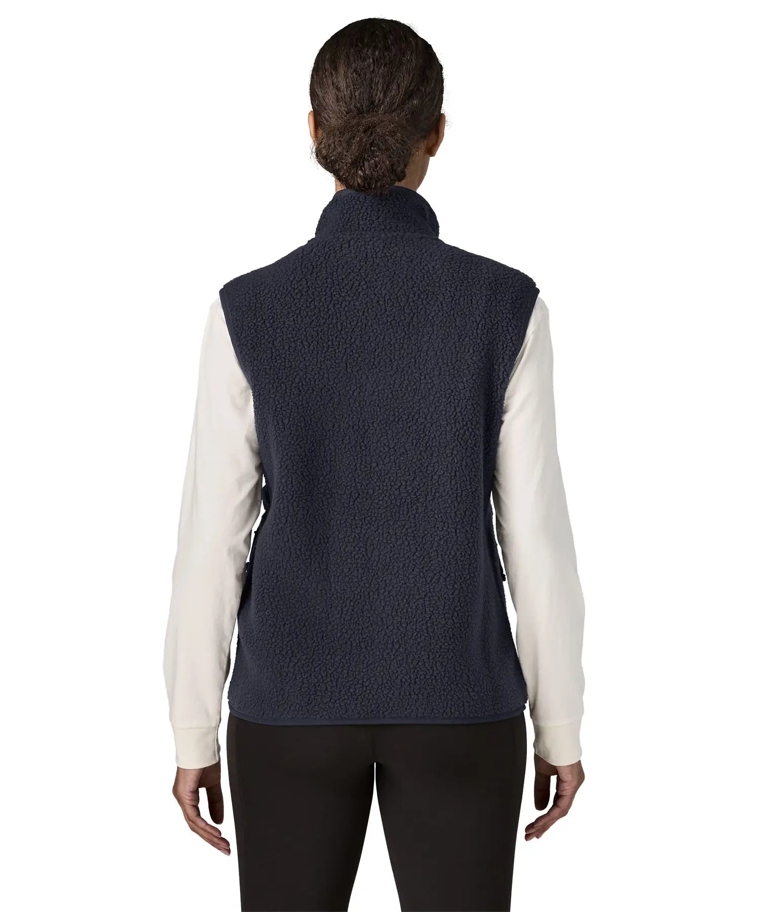 Back of woman wearing the Patagonia women's retro pile fleece vest gilet in sunken blue.