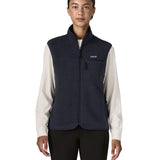 Woman wearing the Patagonia women's retro pile fleece vest gilet in sunken blue. Full length zip gilet with zippered chest and hand warmer pockets.