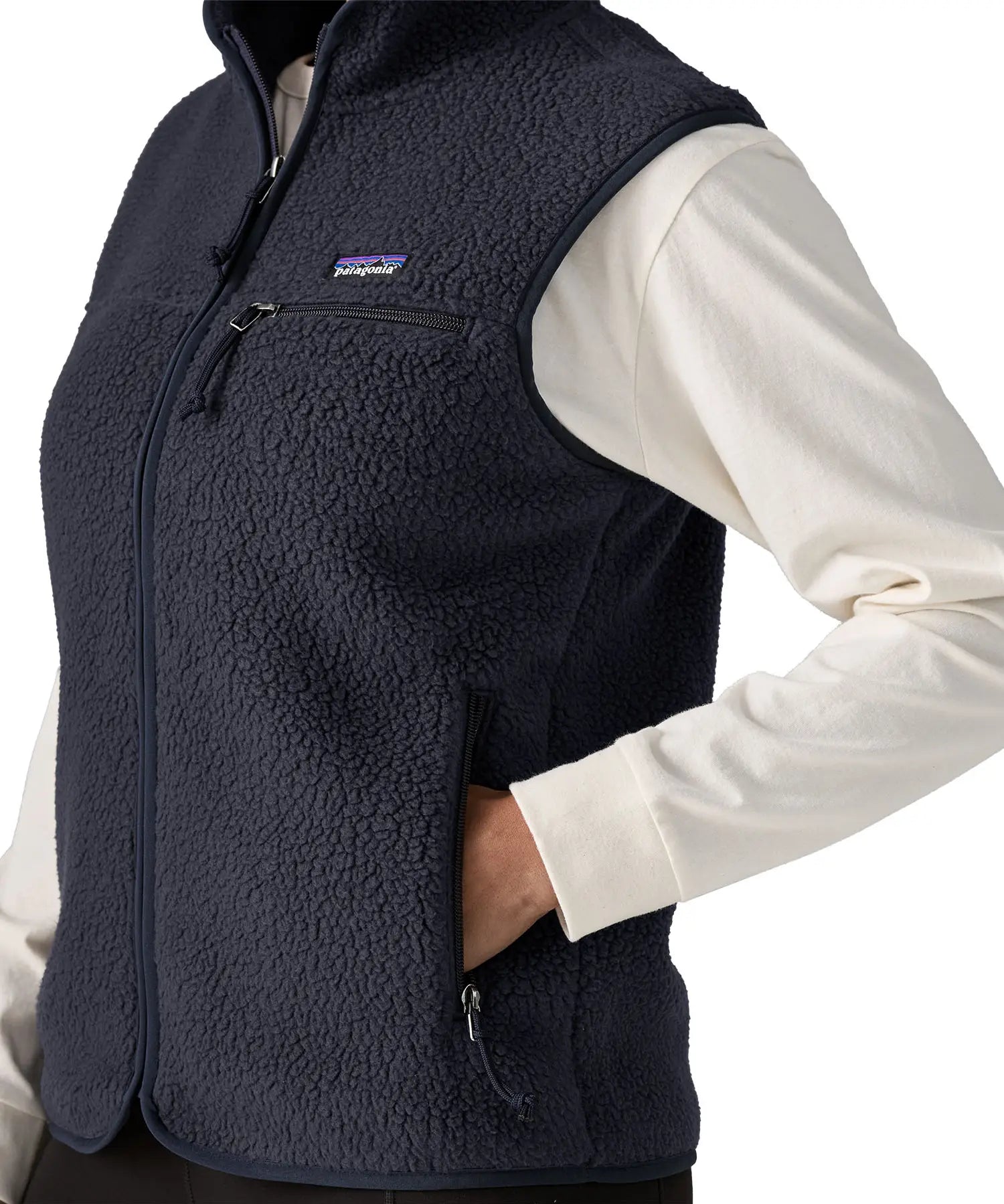 Side of woman wearing the Patagonia women's retro pile fleece vest gilet in sunken blue.