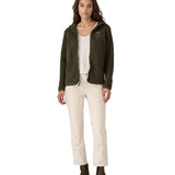 A woman with dark wavy hair wearing a  Patagonia Women's Retro Pile Hoody Pine Needle Green
