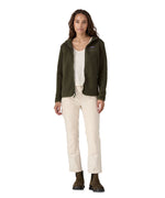 A woman with dark wavy hair wearing a  Patagonia Women's Retro Pile Hoody Pine Needle Green