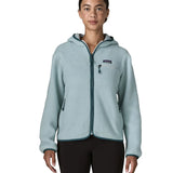 Woman wearing Patagonia women's retro pile hoody in virtually blue. Zipped chest pocket and hand warmer pockets.