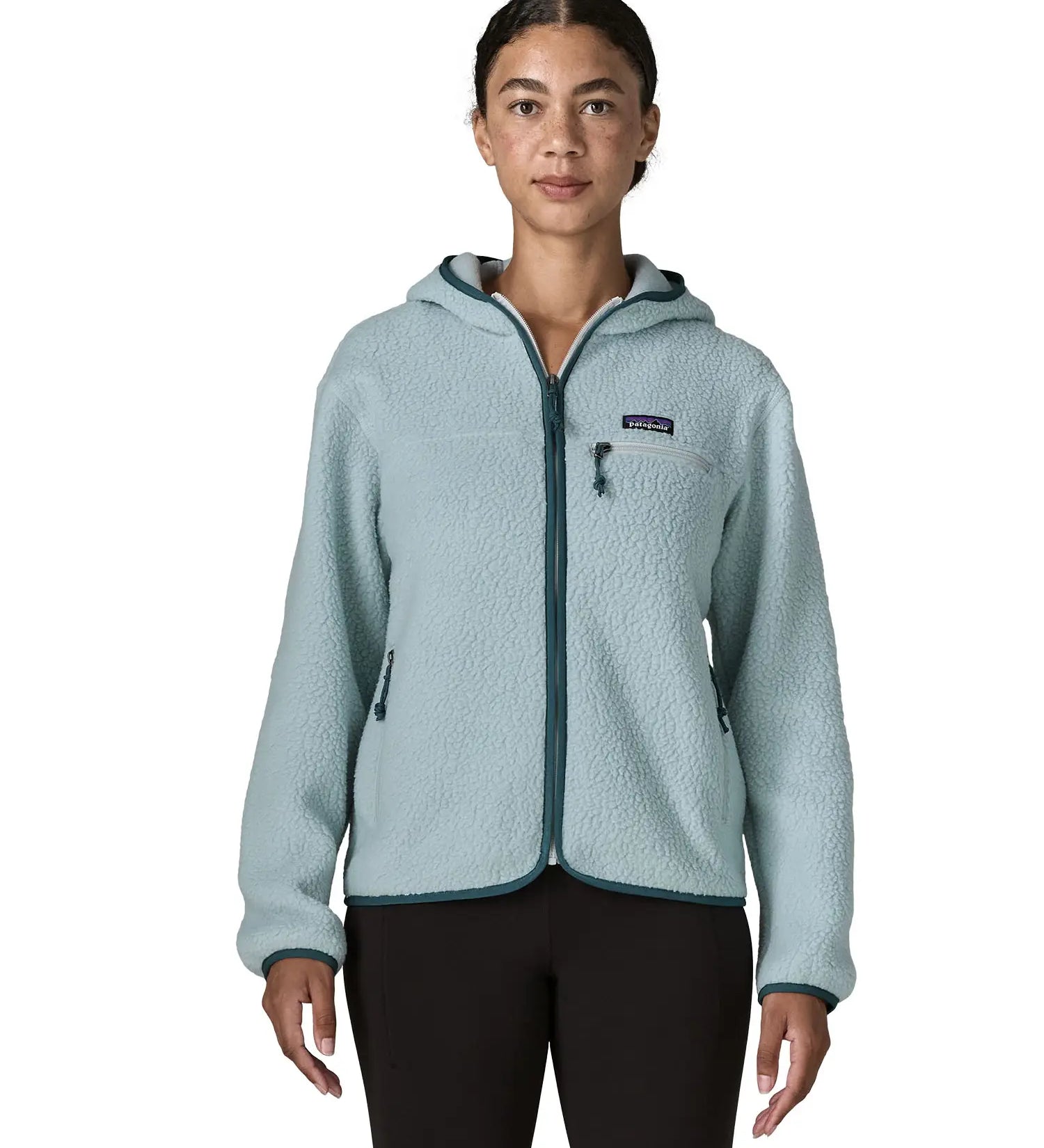 Woman wearing Patagonia women's retro pile hoody in virtually blue. Zipped chest pocket and hand warmer pockets.