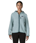 Woman wearing Patagonia women's retro pile hoody in virtually blue. Zipped chest pocket and hand warmer pockets.