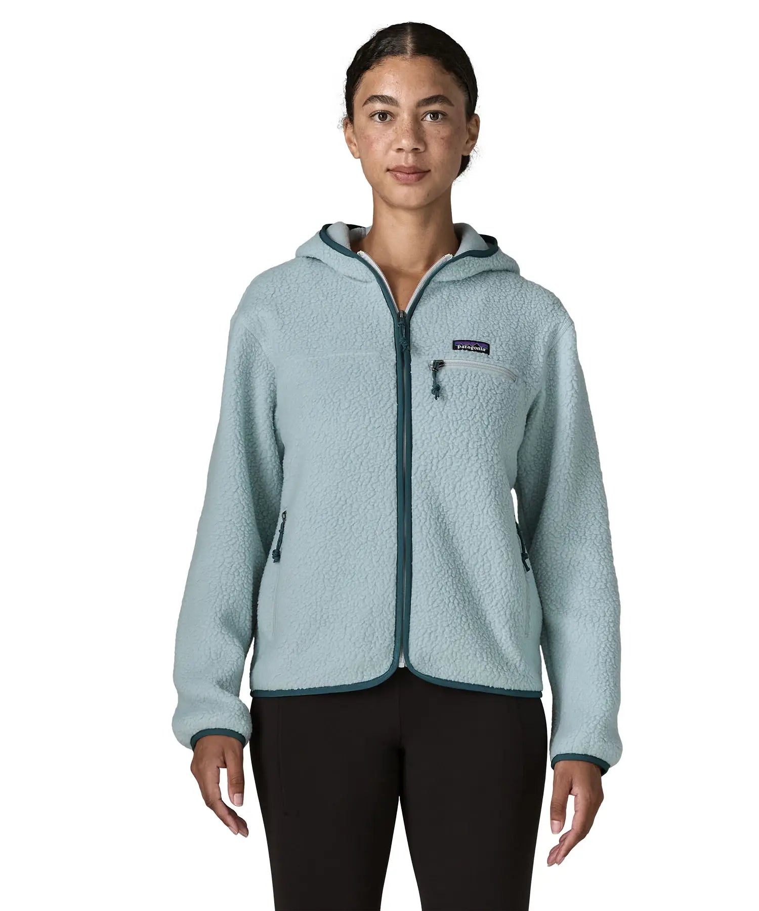 Woman wearing Patagonia women's retro pile hoody in virtually blue. Zipped chest pocket and hand warmer pockets.