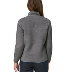 The back of a woman wearing a grey coloured Patagonia Women's Retro Pile Jkt