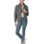 A woman wearing a grey coloured Patagonia Women's Retro Pile Jkt