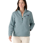A woman with long dark hair wearing the Patagonia Women's Retro Pile Marsupial Thermal Blue