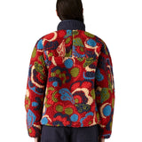 Rear view of the Patagonia river river amanita red retro fleece jacket worn by an adult. 