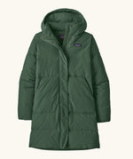 Patagonia women's sisar down insulated parka in canopy green with two large front pockets.