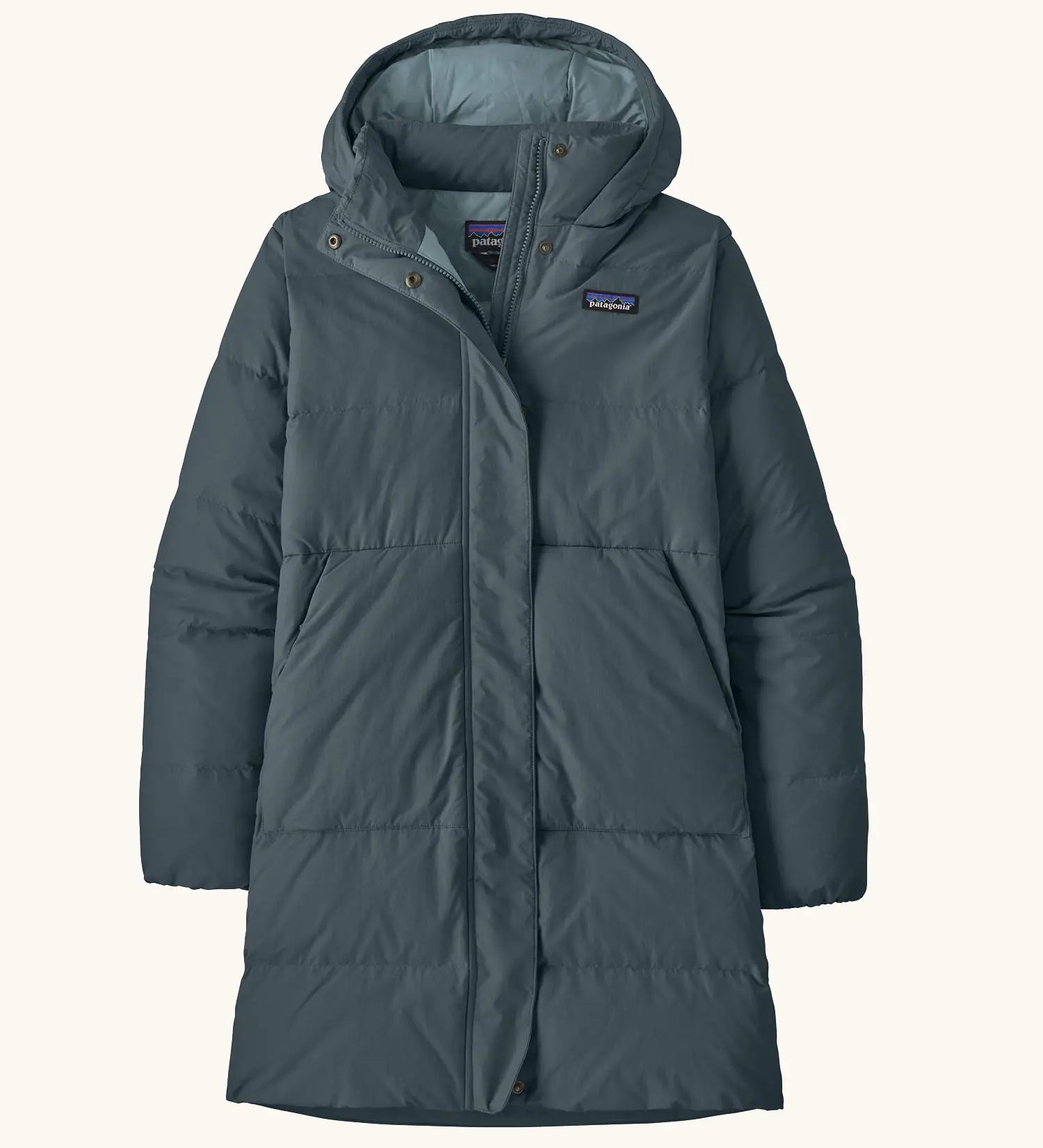 Patagonia women's sisar down insulated parka in summit blue with two large front pockets.