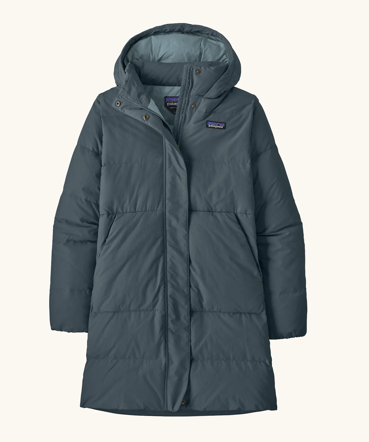 Patagonia women's sisar down insulated parka in summit blue with two large front pockets.