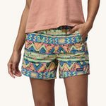 A close up of the Patagonia Women's Baggies Shorts - High Hopes Geo / Salamander Green showing water drops on the fabric