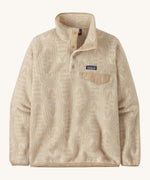Patagonia women's synchilla jacket. A light cream flowing patterned fleece type jacket. Features the logo patch stitched on the left chest pocket, popper fasteners and a chest pocket. 