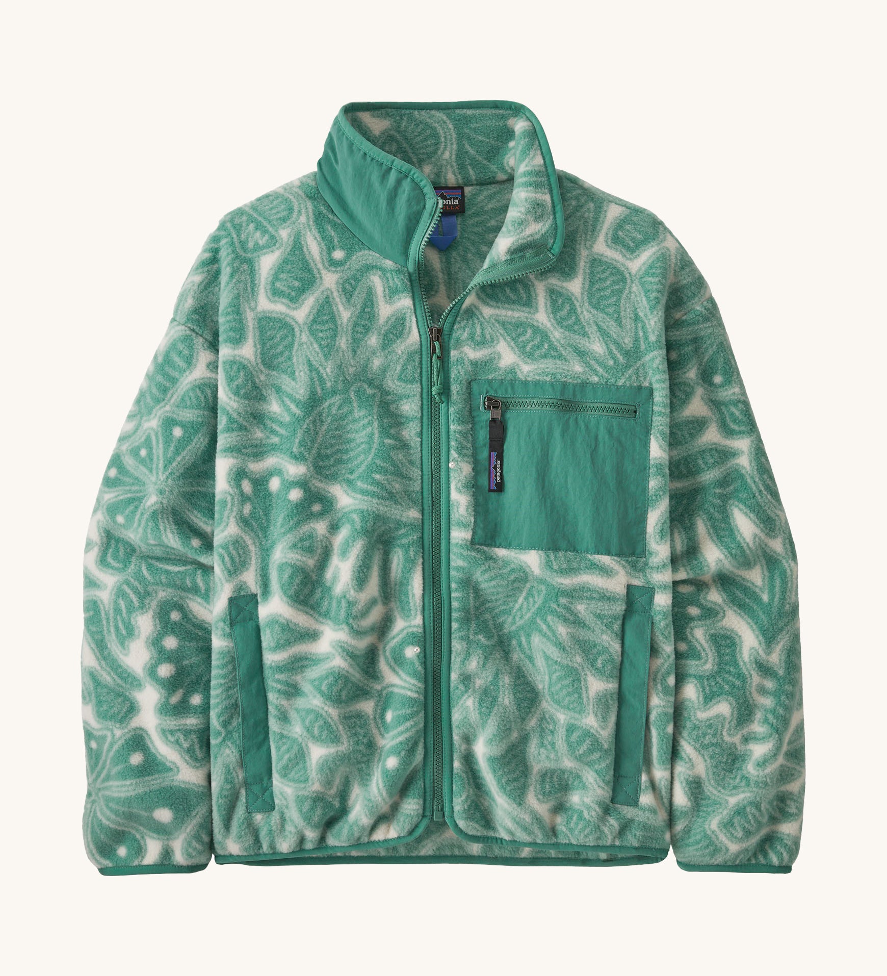 Patagonia women's synchilla fleece made from 100% recycled polyester in pale grey with a foliage pattern in light green. It features a full length zip and patch chest pocket in light green. 