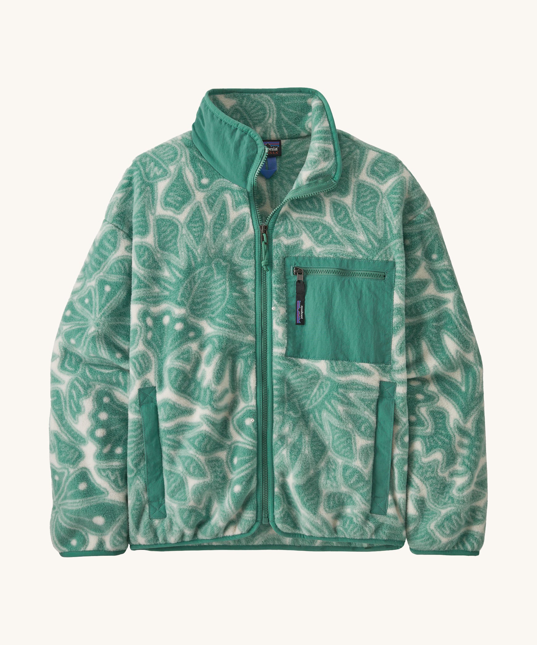 Patagonia women's synchilla fleece made from 100% recycled polyester in pale grey with a foliage pattern in light green. It features a full length zip and patch chest pocket in light green. 