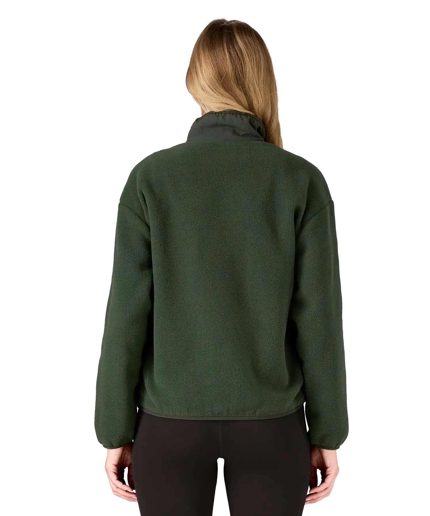 Back of woman wearing the Patagonia women's synchilla fleece jacket in dark green.
